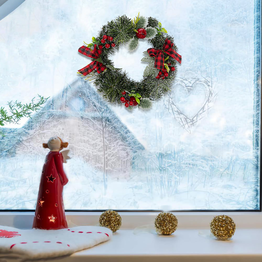 Artisasset A Christmas Wreath Decorated With Apples And Raspberries With Red Bows