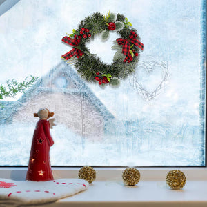 Artisasset A Christmas Wreath Decorated With Apples And Raspberries With Red Bows